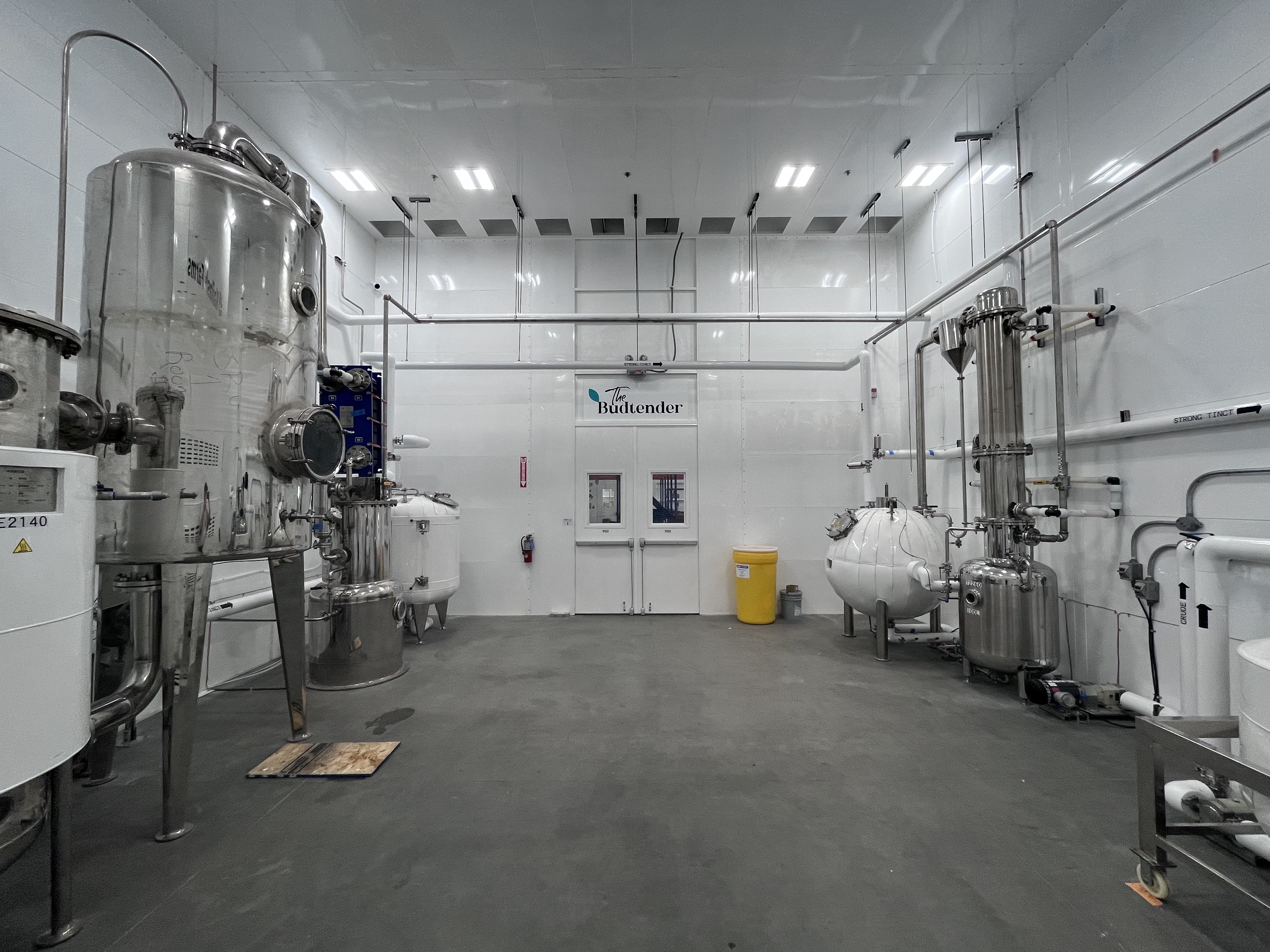 Stainless steel extraction tanks inside The Budtender processing facility